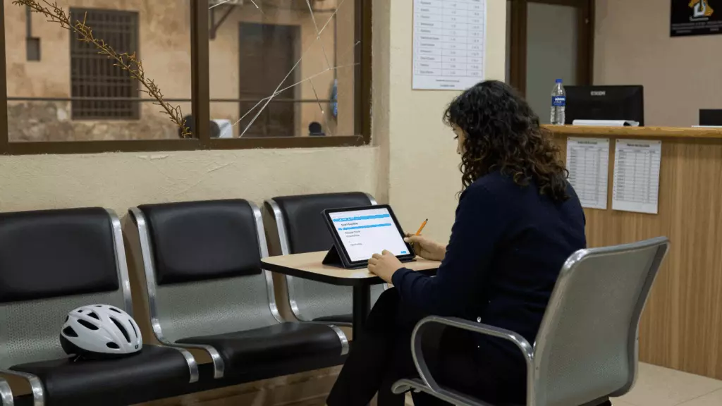 an Arab man in his early 30s working through محاكاة