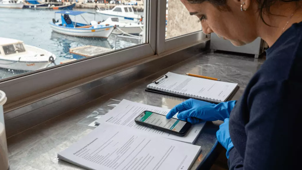 an Arab man in his early 30s working through تحقق