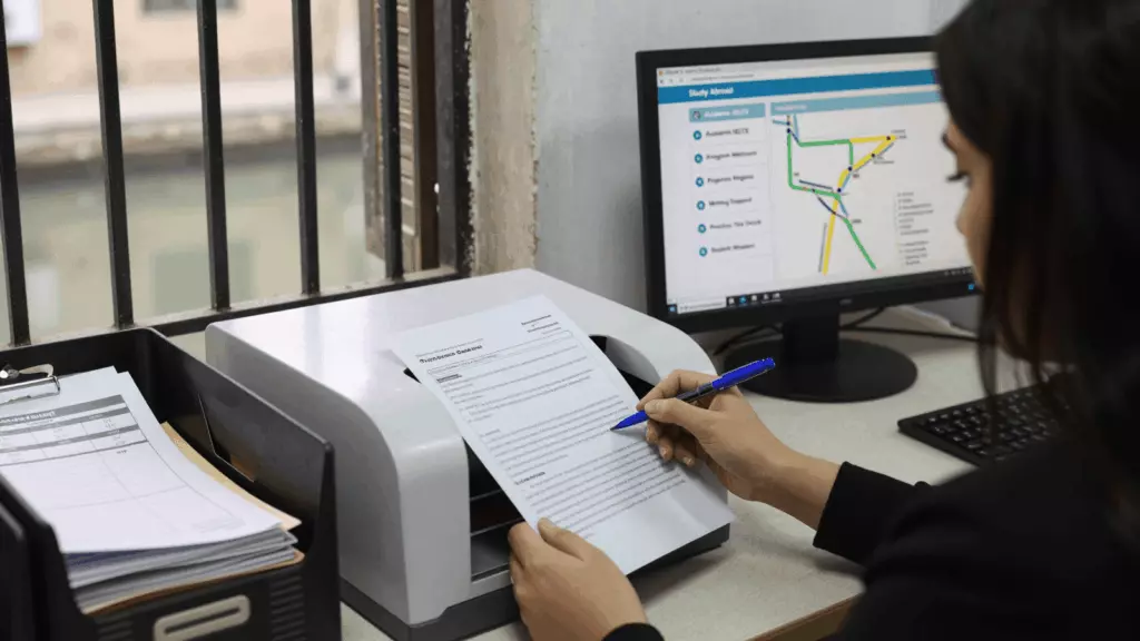 an Arab man in his early 30s reviewing an IELTS online course workflow