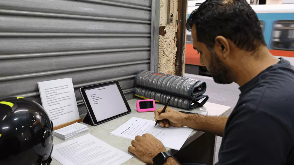 an Arab man in his early 30s working through مسودة