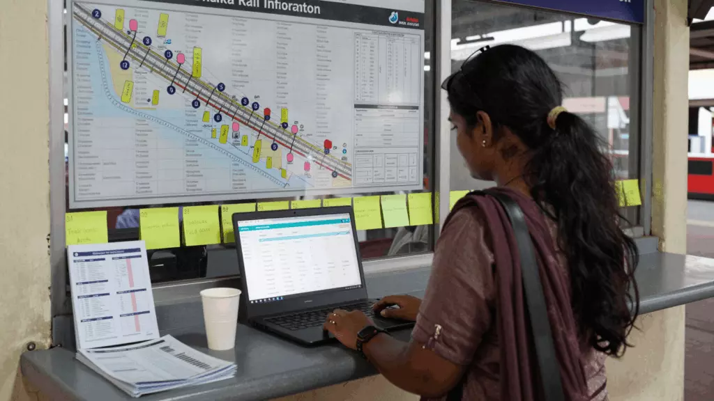 a Bangladeshi woman in her late 20s reviewing an IELTS online course workflow