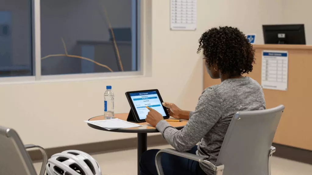 a multiracial woman in her late 20s working through Simulate