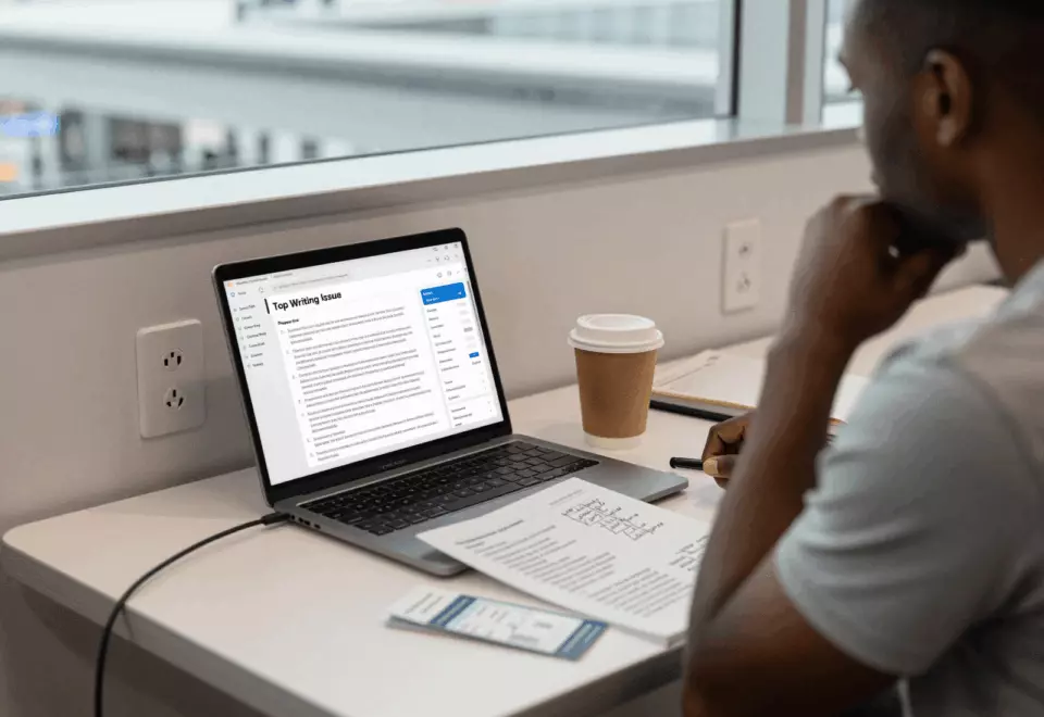 a Black man in his late 20s choosing the next IELTS prep step online