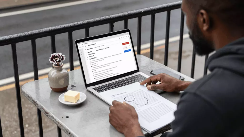 a Black man in his late 20s reviewing an IELTS online course workflow