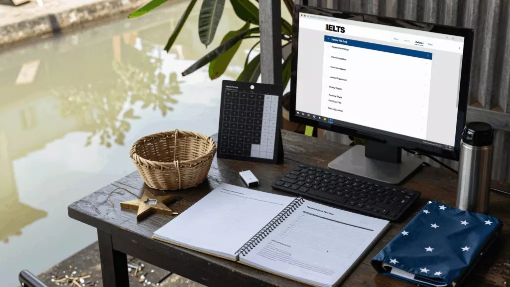 a Sri Lankan man in his late 20s reviewing an IELTS online course workflow