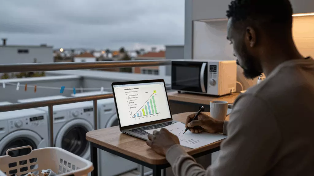 a Black man in his late 20s reviewing an IELTS online course workflow