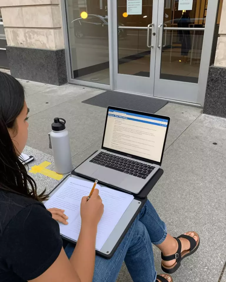 a Latina woman in her late 20s preparing online for Free IELTS Writing Checker: Useful or Not Enough for Band 7?
