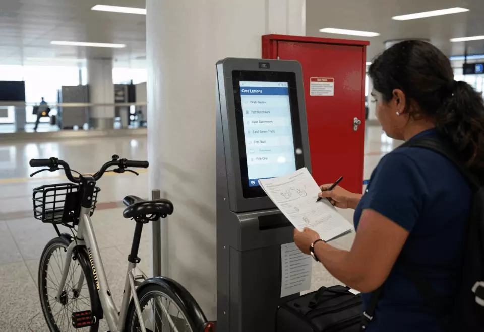 a Latina woman in her late 20s choosing the next IELTS prep step online