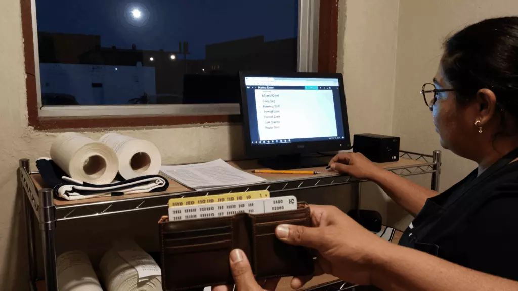 a Latina woman in her late 20s reviewing an IELTS online course workflow