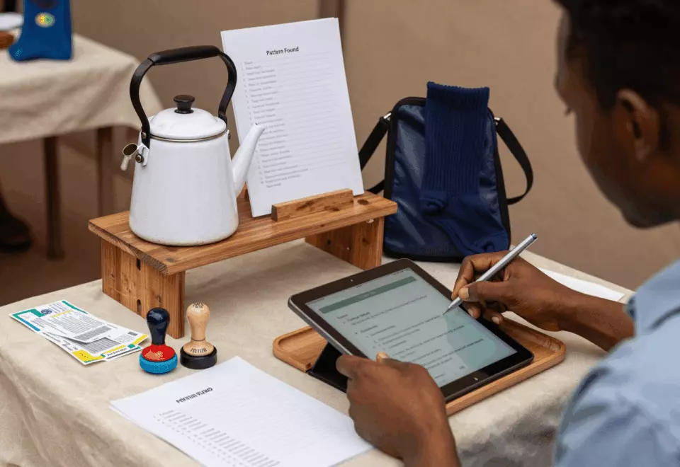 a Francophone African man in his late 20s choosing the next IELTS prep step online
