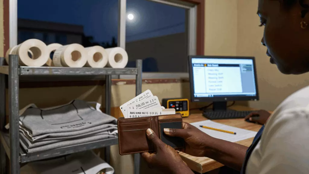 a Francophone African man in his late 20s reviewing an IELTS online course workflow