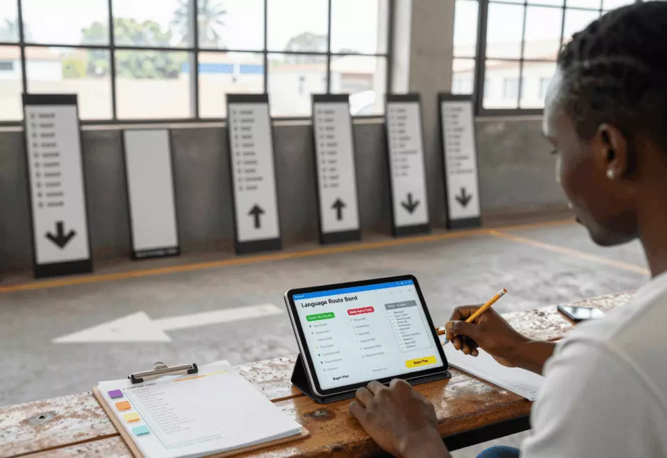 a Francophone African man in his late 20s choosing the next IELTS prep step online