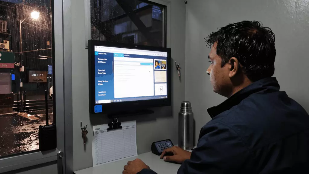 an Indian woman in her late 20s reviewing an IELTS online course workflow