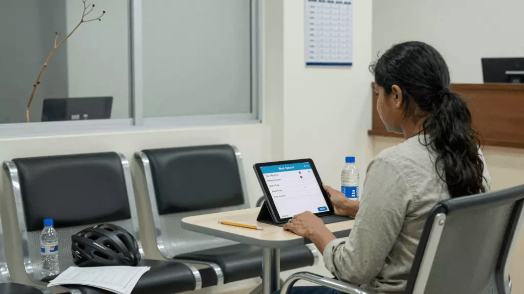 an Indian woman in her late 20s working through अनुकरण