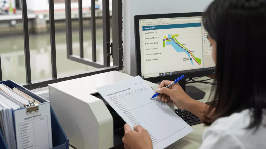 an Indonesian woman in her late 20s reviewing an IELTS online course workflow