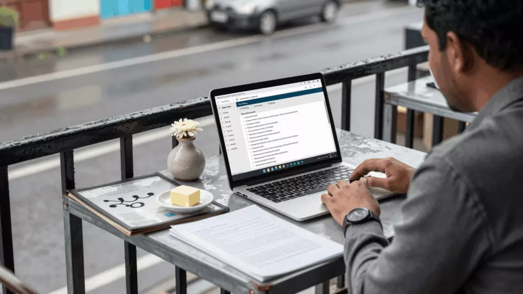 a Nepali woman in her late 20s reviewing an IELTS online course workflow