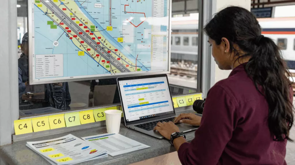 a Nepali woman in her late 20s reviewing an IELTS online course workflow
