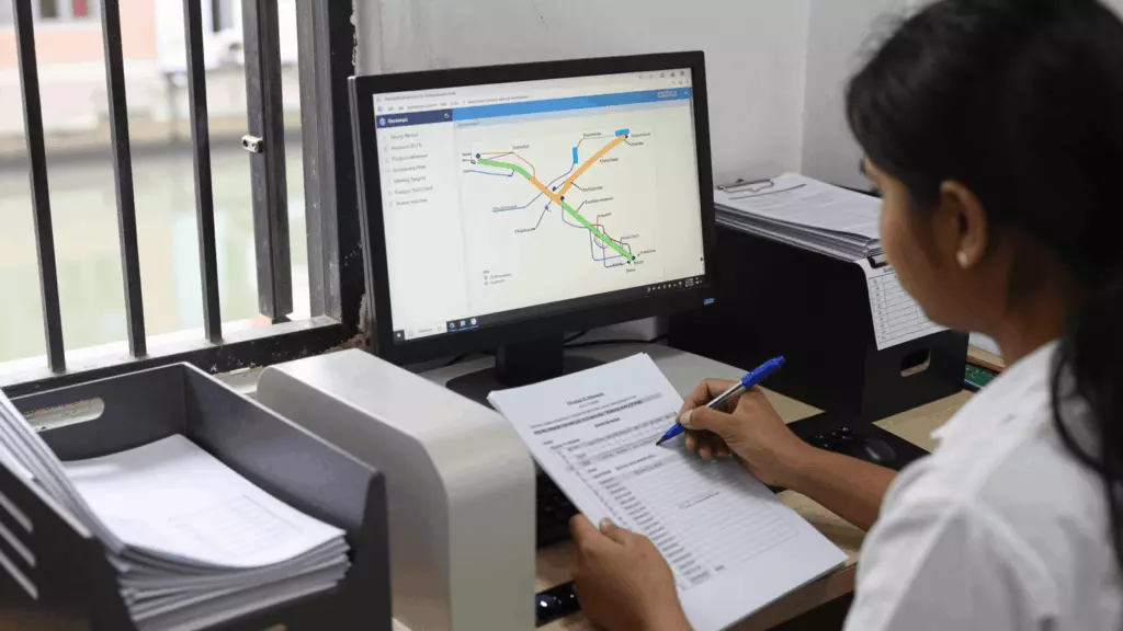 a Nepali woman in her late 20s reviewing an IELTS online course workflow