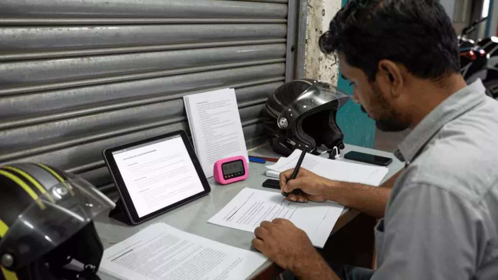 a Nepali woman in her late 20s working through >ड्राफ्ट