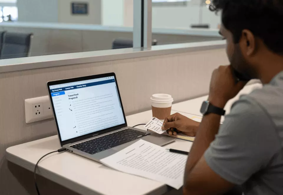 a Sri Lankan woman in her late 20s choosing the next IELTS prep step online