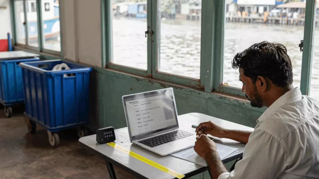 a Tamil woman in her late 20s working through பயிற்சி