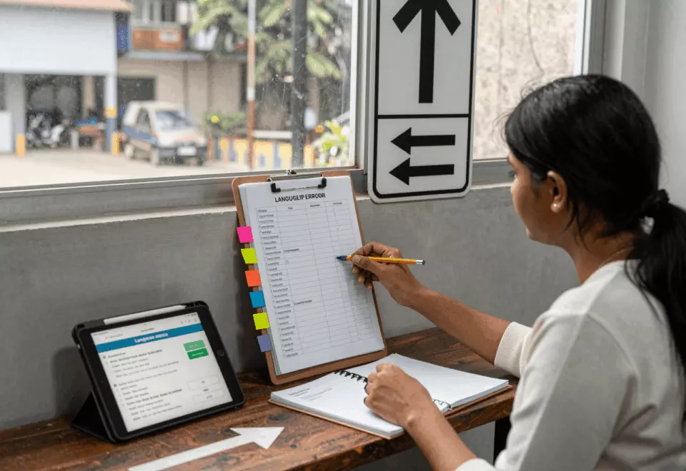 a Tamil woman in her late 20s choosing the next IELTS prep step online
