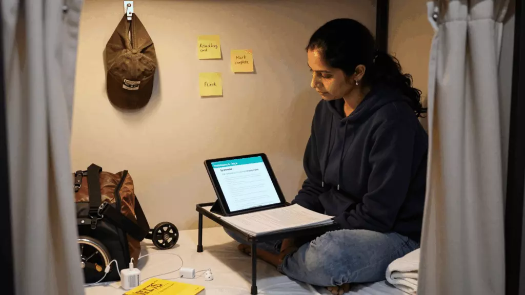 a Pakistani man in his late 20s working through مطالعہ