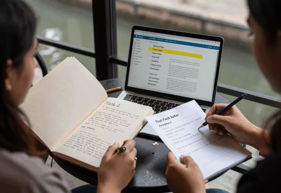 a Pakistani man in his late 20s choosing the next IELTS prep step online