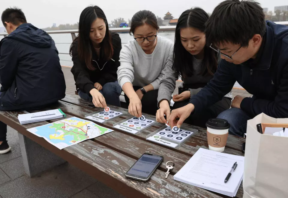 a Chinese woman in her late 20s choosing the next IELTS prep step online